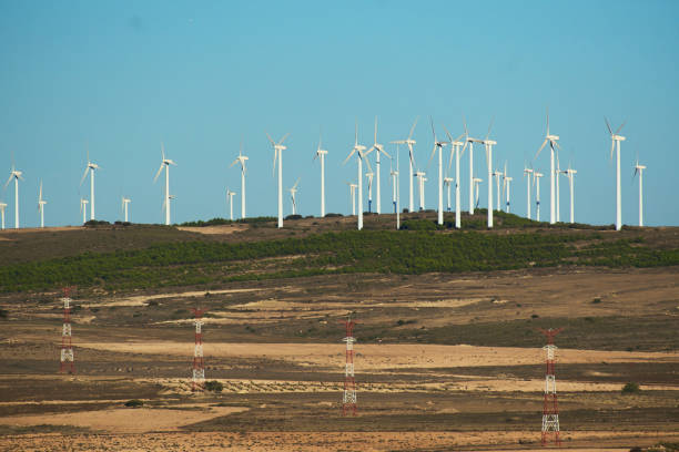 istock wind farm with power towers 1702182863