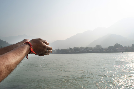 Closeup of hand pooja at ganga river haridwar