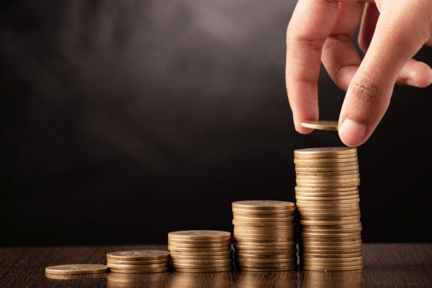 istock Closeup of coin stack investment concept 1702184602