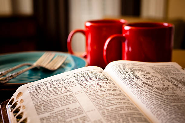 istock Bible and coffee set for two with red mugs plates 170219134