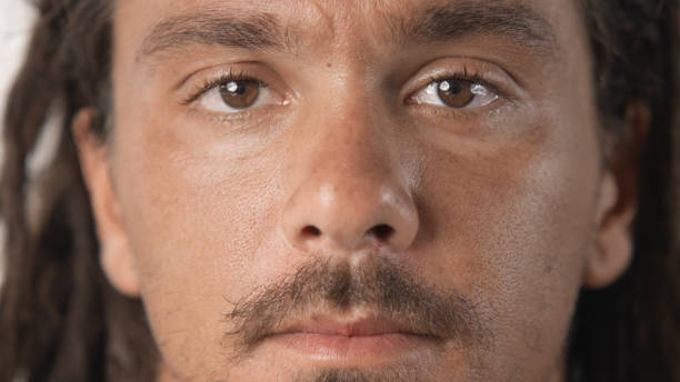 istock Serious man with dreadlock look camera close up. Dreads guy portrait. Hairstyle. 1702194007
