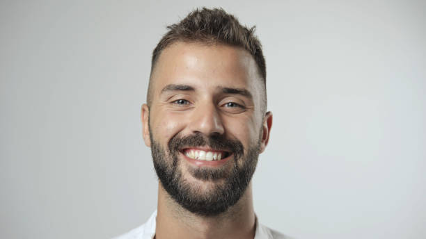 istock Happy man smiling. Handsome european guy look at camera. Face portrait. 1702199542