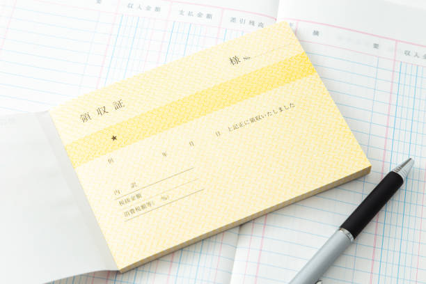 istock Account book and receipt on a white background. 1702214543