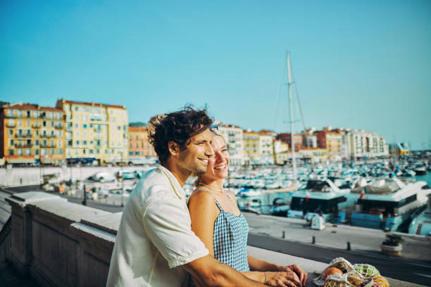 Happy Millennials Discovering the Charm of Southern France, enjoying the coastal city of Nice. stock photo