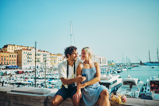 Happy Millennials Discovering the Charm of Southern France, enjoying the coastal city of Nice.