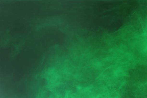 istock Green colorful dye on black background,Art abstract smoke texture,Colored liquid dye,Splash paint,Abstract color,Abstract Textures 1702219389