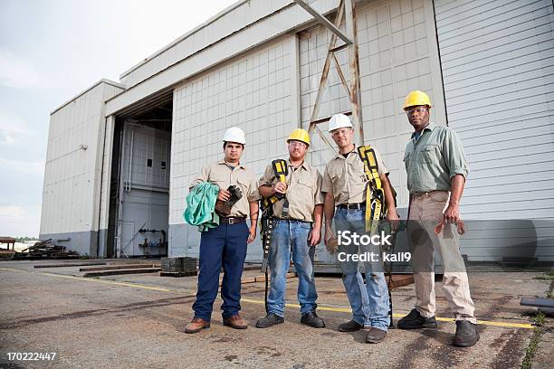 Team Of Construction Workers With Harnesses Stock Photo - Download Image Now - Group Of People, Outdoors, Serious