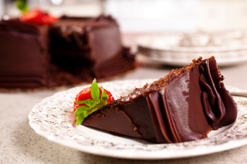 Chocolate Cake slice with Strawberries in domestic kitchen.