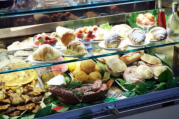 istock Cakes and savouries on display at food counter 170224504