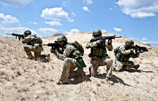 Squad of soldiers in the desert during the military operation