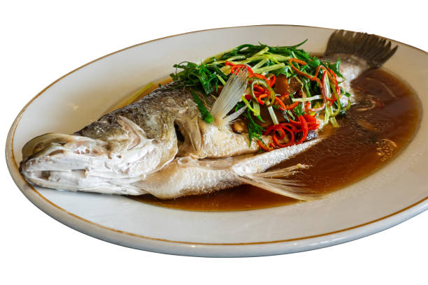 istock Steamed snapper fish with soy sauce in white ceramic plate.5 1702251499