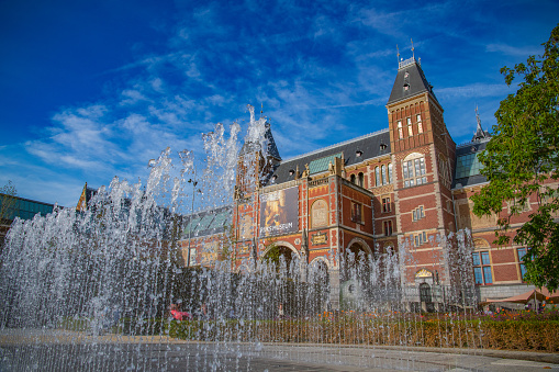 Amsterdam Architecture otuside the Rijksmuseum facades with a blue sky in the background during summer.