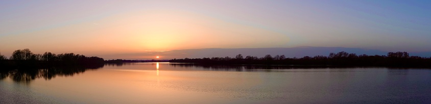 A beautiful panorama of Abberton Reservoir at sunset.
