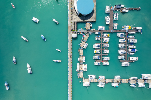 Aerial View Drone shot of Yacht and sailboat parking in marina, Transportation and travel background, Beautiful sea in summer season