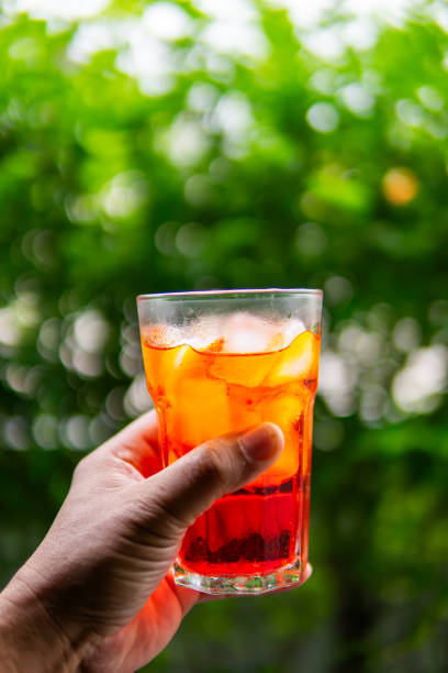 istock Close up hand holding cold drink 1702274192