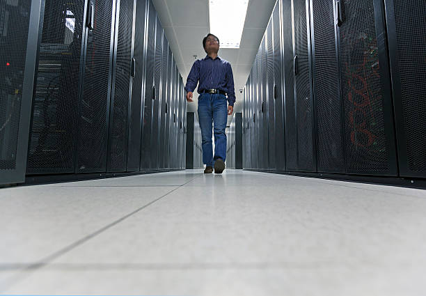 istock Asian administrator is working in the data  center room. 170228215