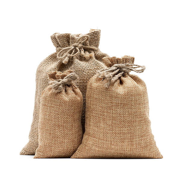 Burlap sack isolated on white background Burlap sack isolated on white background rice sack stock pictures, royalty-free photos & images