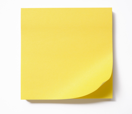 Stacked and page curled yellow sticky note isolated on white background with clipping path.