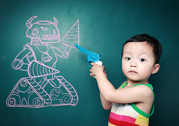 Cute child in front of the blackboard 