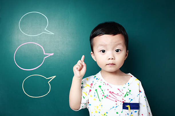 istock Cute child in front of the blackboard 170228884