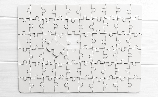 Top view of white jigsaw puzzle
