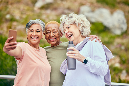 Senior women, fitness or selfie of people on social media together for outdoor exercise in retirement. Photo, diversity or happy elderly friends hiking to take pictures on break in training in park
