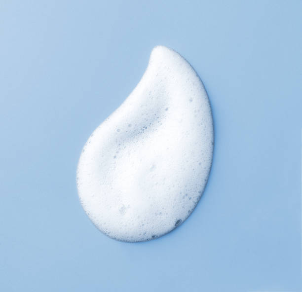istock White skincare cleansing foam on light blue background 1702299821