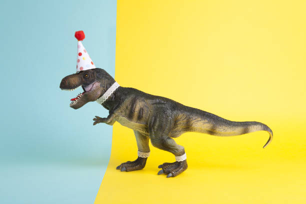 istock a dinosaur, dressed up in lace and a paper party hat 1702307169