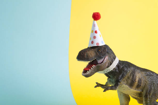 istock a dinosaur, dressed up in lace and a paper party hat 1702307172