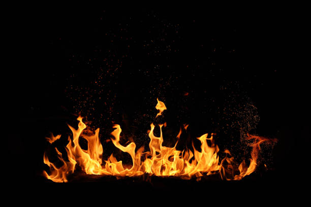 istock Blazing fire border with bright fire sparks isolated black background 1702316867