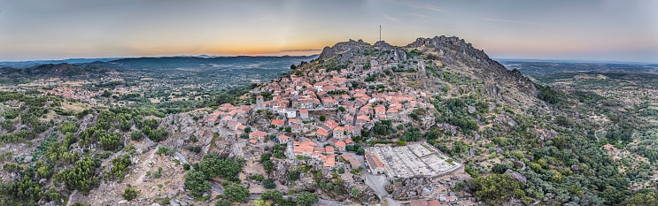 Drone panorama of historic city and fortification Monsanto in Portugal in the morning during summer sunrise
