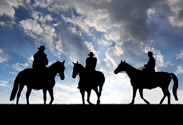 istock Silhouette cowboys with horses 170232556