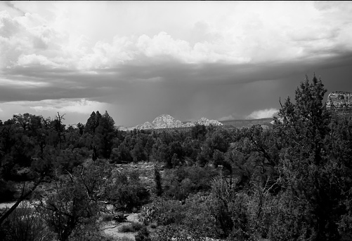 Film black and white image of Sedona Arizona red rock country and surroundng mountain landscape