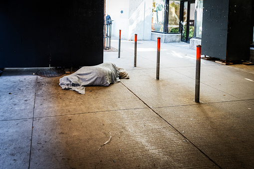 homeless laying on the floor