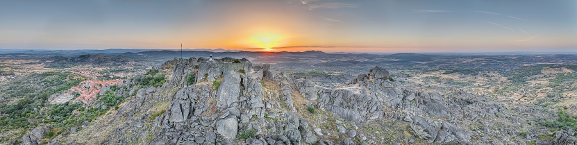 Drone panorama of historic city and fortification Monsanto in Portugal in the morning during summer sunrise
