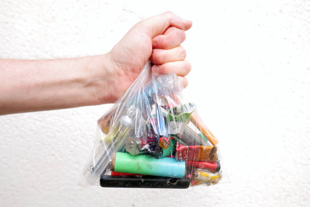 istock Man hold a bag of discarded vapes 1702359568