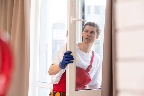 istock A repairman fixing windows in new apartment. 1702367406