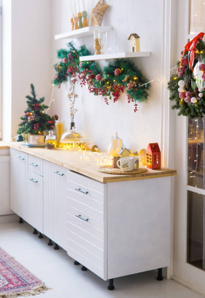 istock Kitchen interior decorated for Christmas and New Year. New Year's interior in red and white tones. 1702400687
