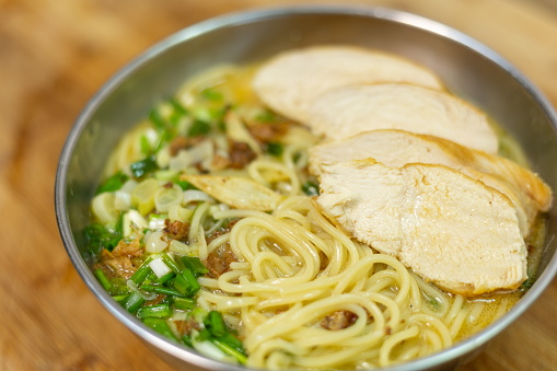 Ramen noodle soup with chicken breast, egg and spinach