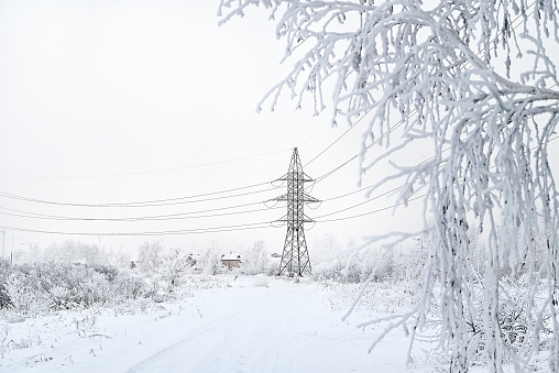 Power lines in the winter forest.Power lines in the winter forest. Power outages due to severe frost. Abnormal weather.