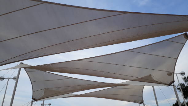 istock Fabrics to cover the sun and make shadows, with triangular shapes 1702447121