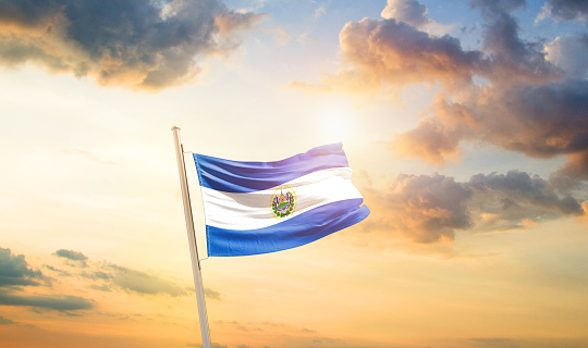 El Salvador national flag waving in the sky.