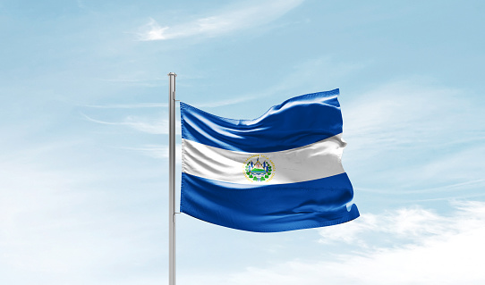 El Salvador national flag waving in the sky.