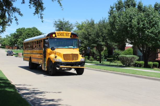 istock Public school bus arriving to drop off students 1702460287
