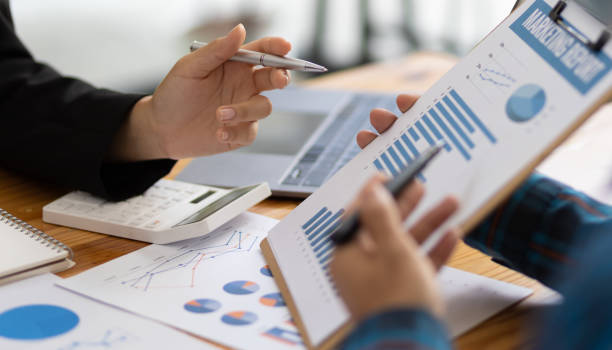 istock Businessman cooperation discussing working analyzing with financial data and marketing growth report graph in team, presentation and brainstorming to strategy planning making profit of company. 1702463686