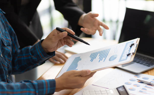 istock Businessman cooperation discussing working analyzing with financial data and marketing growth report graph in team, presentation and brainstorming to strategy planning making profit of company. 1702463717
