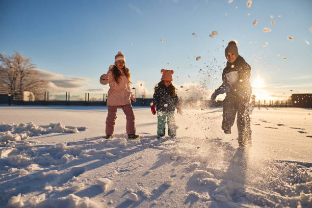 istock Happy kids enjoying winter snow 1702475004