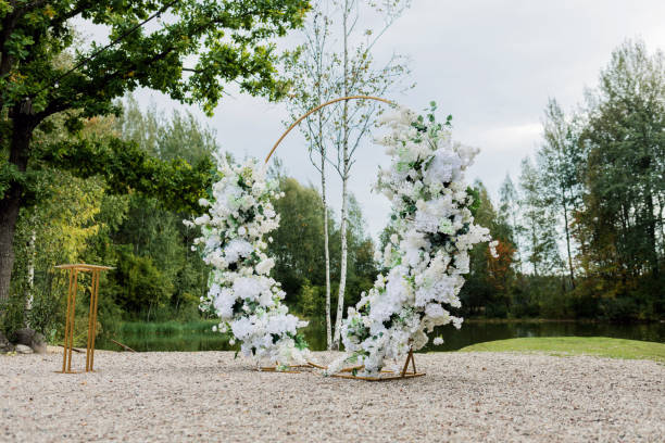 istock Decorating the arch with flowers 1702485744