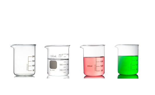 A set of beakers used in a chemistry laboratory was isolated on a white background.