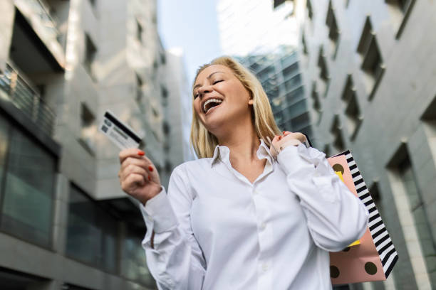 istock Young Woman's Shopping Triumph 1702491751